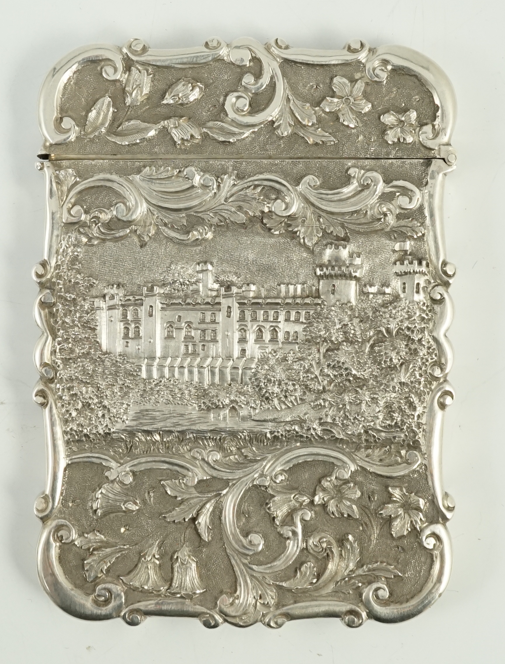 An early Victorian silver 'castle top' card case by Nathaniel Mills, depicting Windsor and Warwick castles, in fitted case